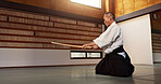 Fitness, stick or sensei martial arts in dojo for practice routine, aikido movement or self defense. Combat demonstration, mature Japanese person or training workout for fighting, education or class