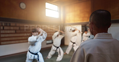 Buy stock photo Aikido, dojo and class with sensei, weapon training and wooden sword for self defence exercise. Group, student or athlete in Japanese studio gym with fight challenge, black belt practice and fitness