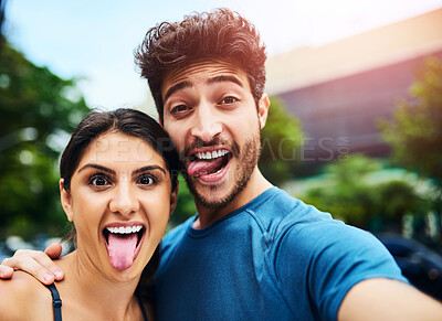 Buy stock photo Selfie, couple and silly for social media, profile picture and funny for comedy and online. Park, outside and nature for exercise or run club, married people and together for goofy memories in forest