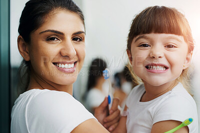 Buy stock photo Mother, child and brushing teeth portrait for dental hygiene, health and wellness learning with smile. Home, bathroom and young girl with toothbrush, teeth and cleaning at morning with love and care