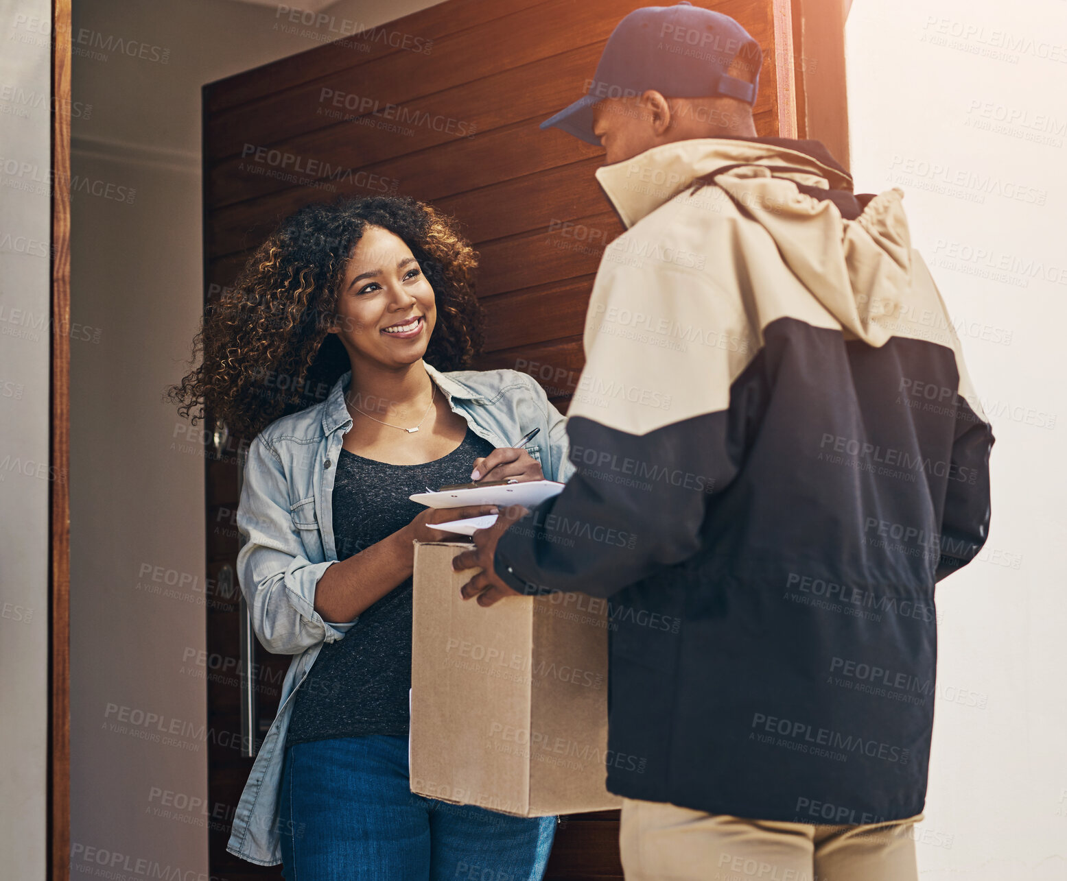 Buy stock photo Happy woman, delivery and box with signature for confirmation, agreement or parcel received by door at home. Female person with smile for package, signing or online order from courier guy at house