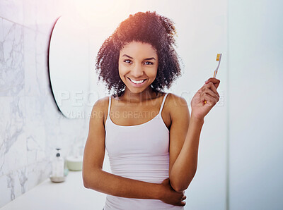 Buy stock photo Portrait, smile and African woman with toothbrush for dental hygiene, wellness or morning routine. Face, teeth and oral health of girl in bathroom for orthodontics, cleaning and fresh breath in home