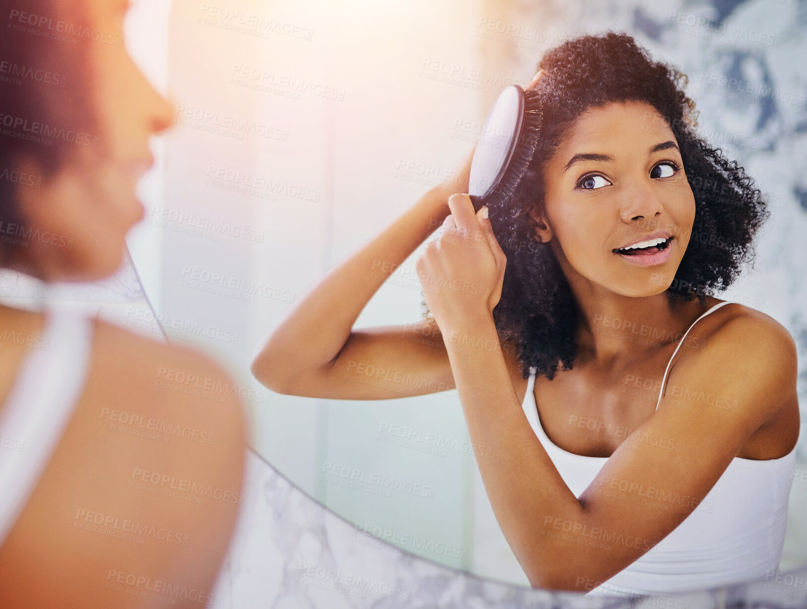 Buy stock photo Morning, hair care and black woman in mirror with brush, smile and getting ready for afro style routine in home. Grooming, conditioner and girl in bathroom reflection with healthy keratin treatment