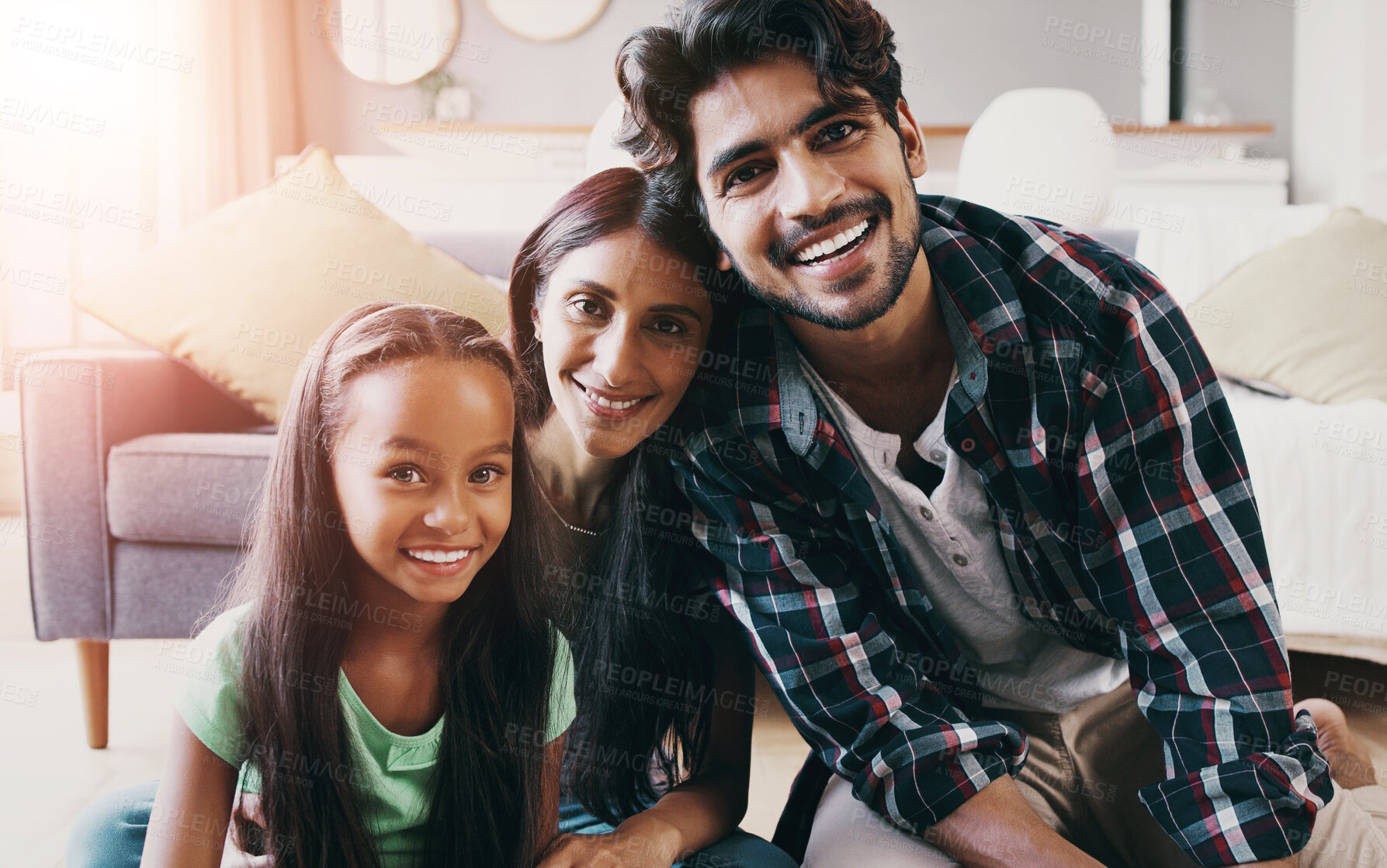 Buy stock photo Family, smile and happy in home for relax, vacation and weekend with support, care and face. Woman, man and girl in India for development, love and bonding with portrait, lens flare and holiday
