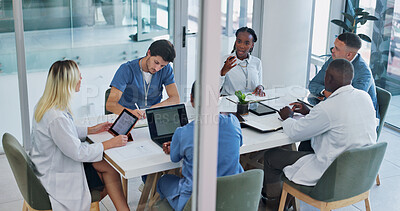 Buy stock photo Medical, group and meeting for healthcare in conference room with technology, top view and discussion. Collaboration, doctor and nurse team in boardroom for surgery brainstorming and health planning