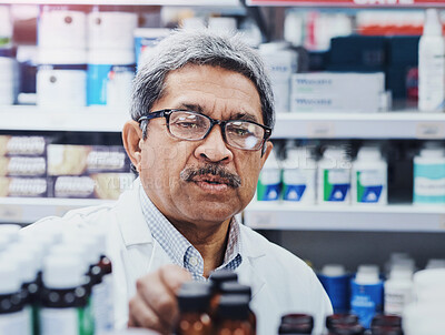 Buy stock photo Face, mature man and pharmacist in medication shelf at shop for customer prescription. Medical, healthcare and treatment or pills in drug store with medicine in pharmaceutical retail for help