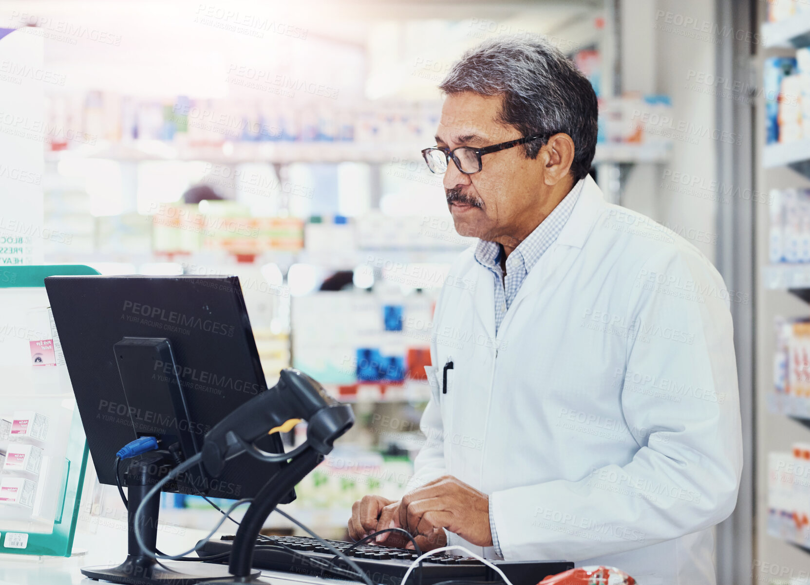 Buy stock photo Mature, man and online with computer in pharmacy for order or inventory management, stock monitoring and research. Pharmacist, technology and checking patient records and prescription processing.