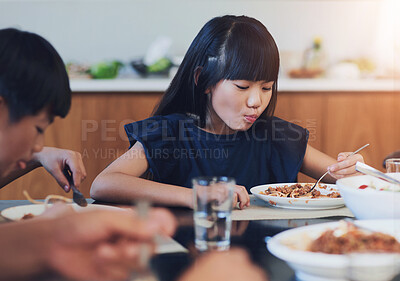 Buy stock photo Food, hunger and girl eating at dining room table of home for family meal, health or wellness. Eating, nutrition and child development with child in apartment for cuisine, diet or pasta dish