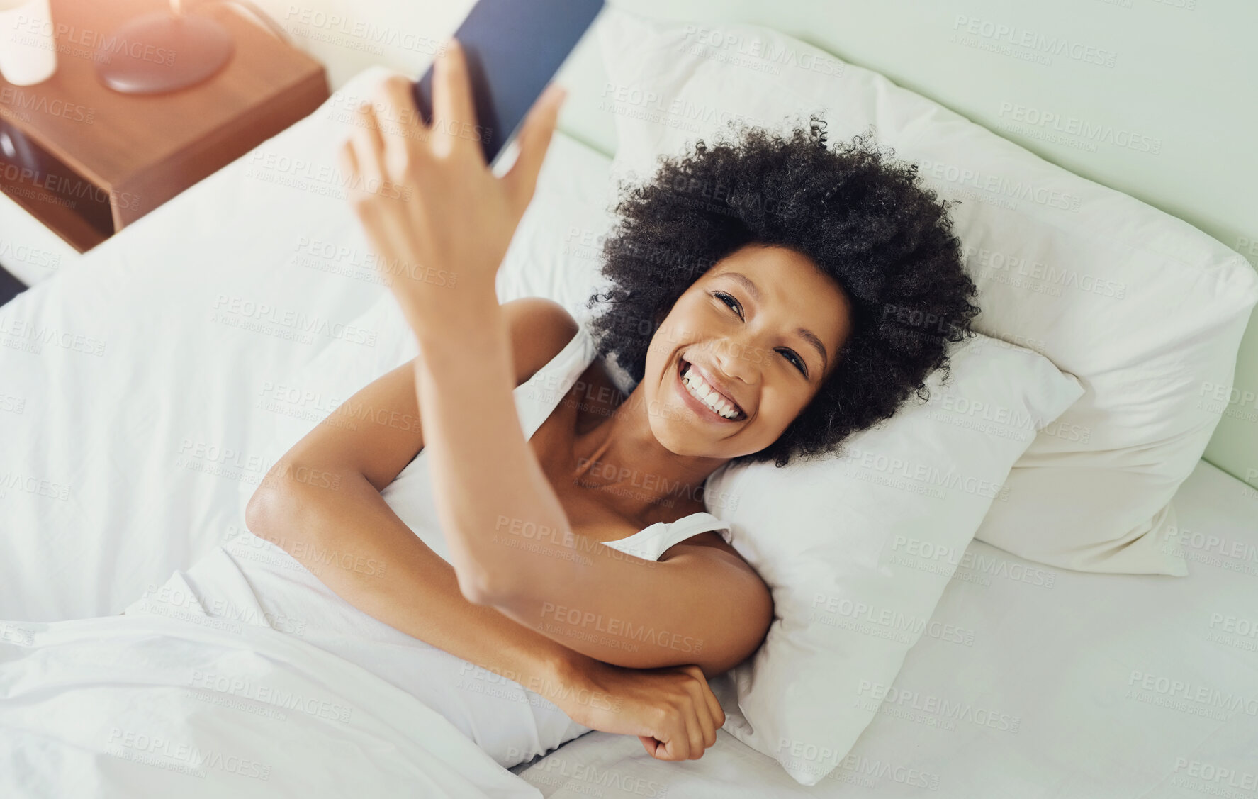 Buy stock photo Black woman, selfie and bed with smile in the morning with social media post and profile picture. Home, happy and online with web photo for content creation, internet and app in a bedroom with tech