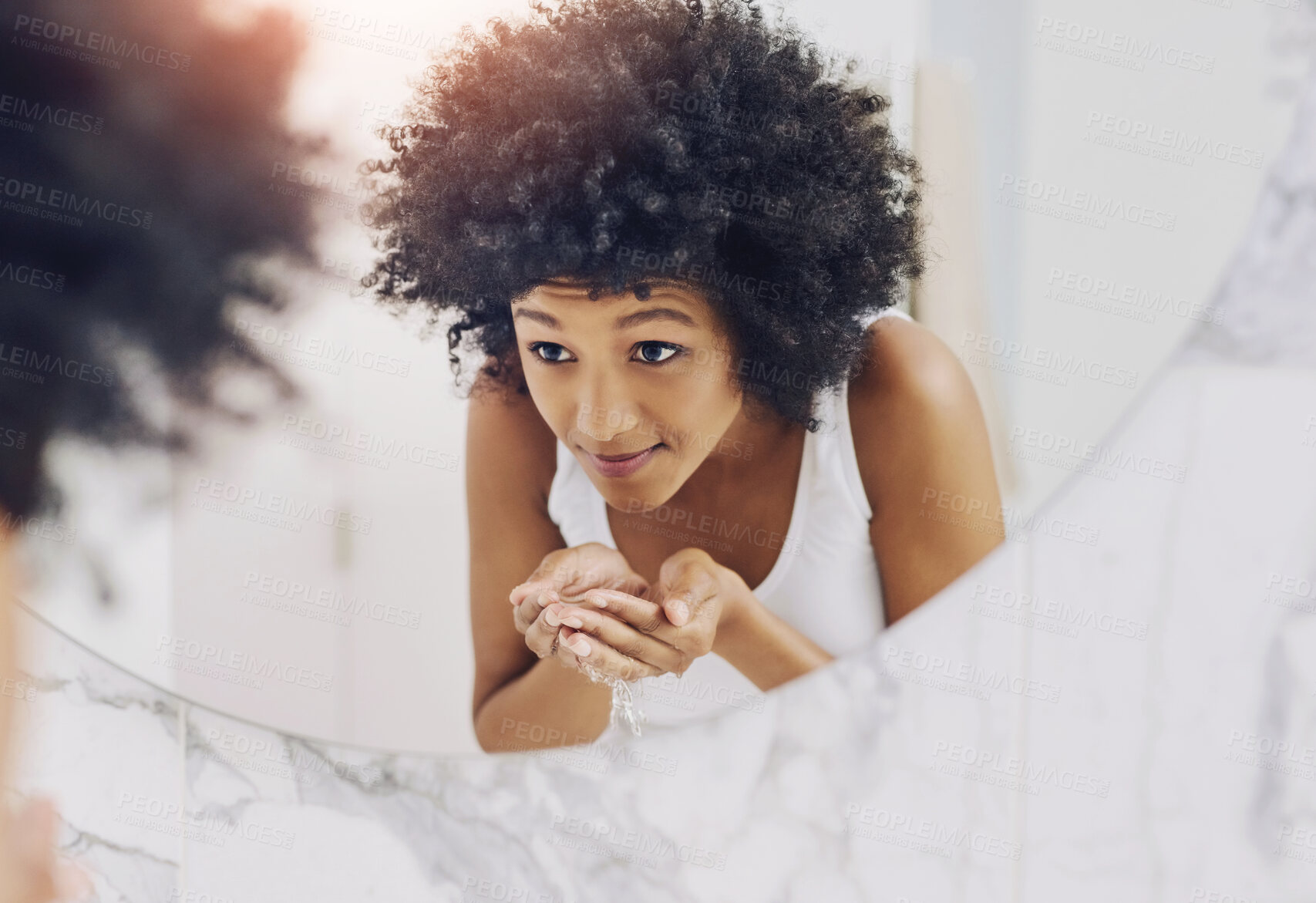 Buy stock photo African woman, mirror and wash face in bathroom with water for beauty, skincare and wellness. Happy girl, reflection and cleaning facial in home with liquid as morning routine for skin glow or shine