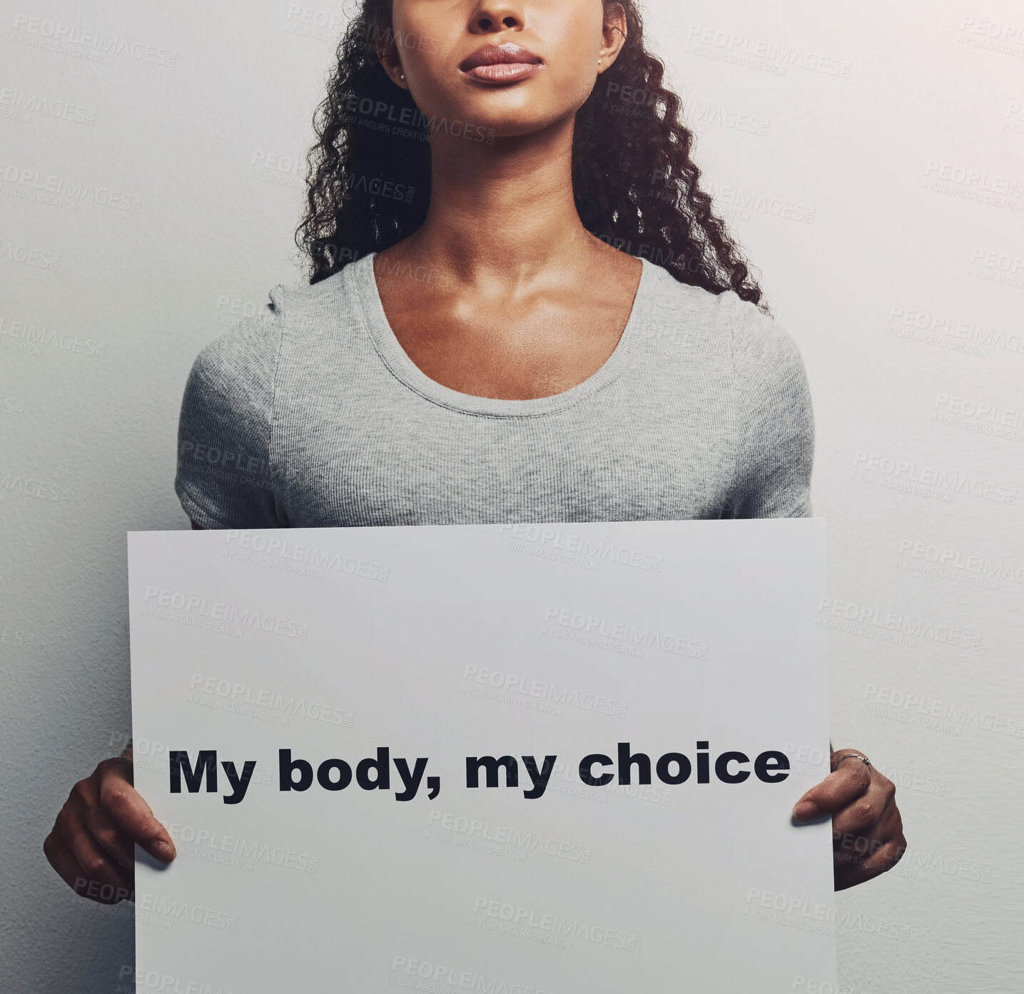 Buy stock photo Woman, hands and poster with message for notification, text or empowerment on a white background. Female person, studio or model with billboard, sign or note for protest, awareness or choice