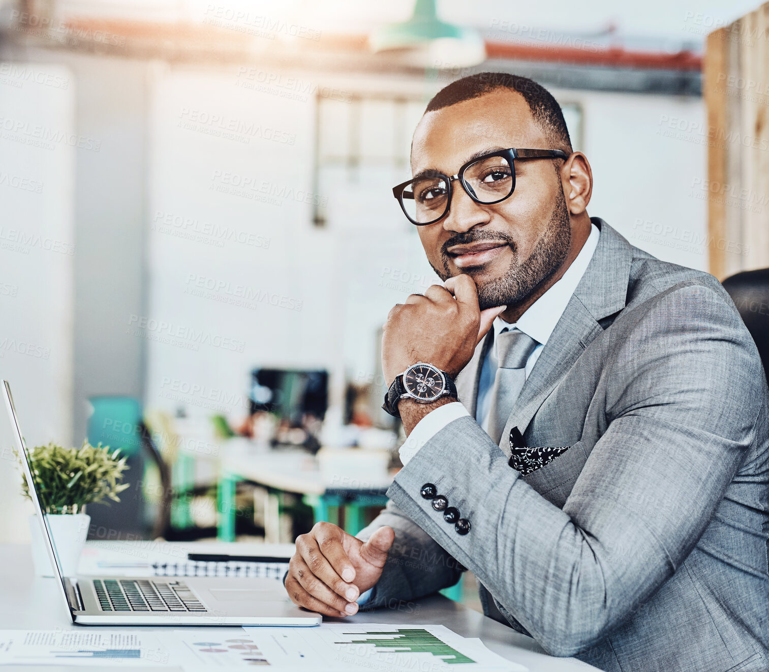 Buy stock photo Portrait, glasses and businessman with laptop in office for economy research, entrepreneur and data analytics. Financial advisor, computer and paper stats for analysis, startup agency and web article