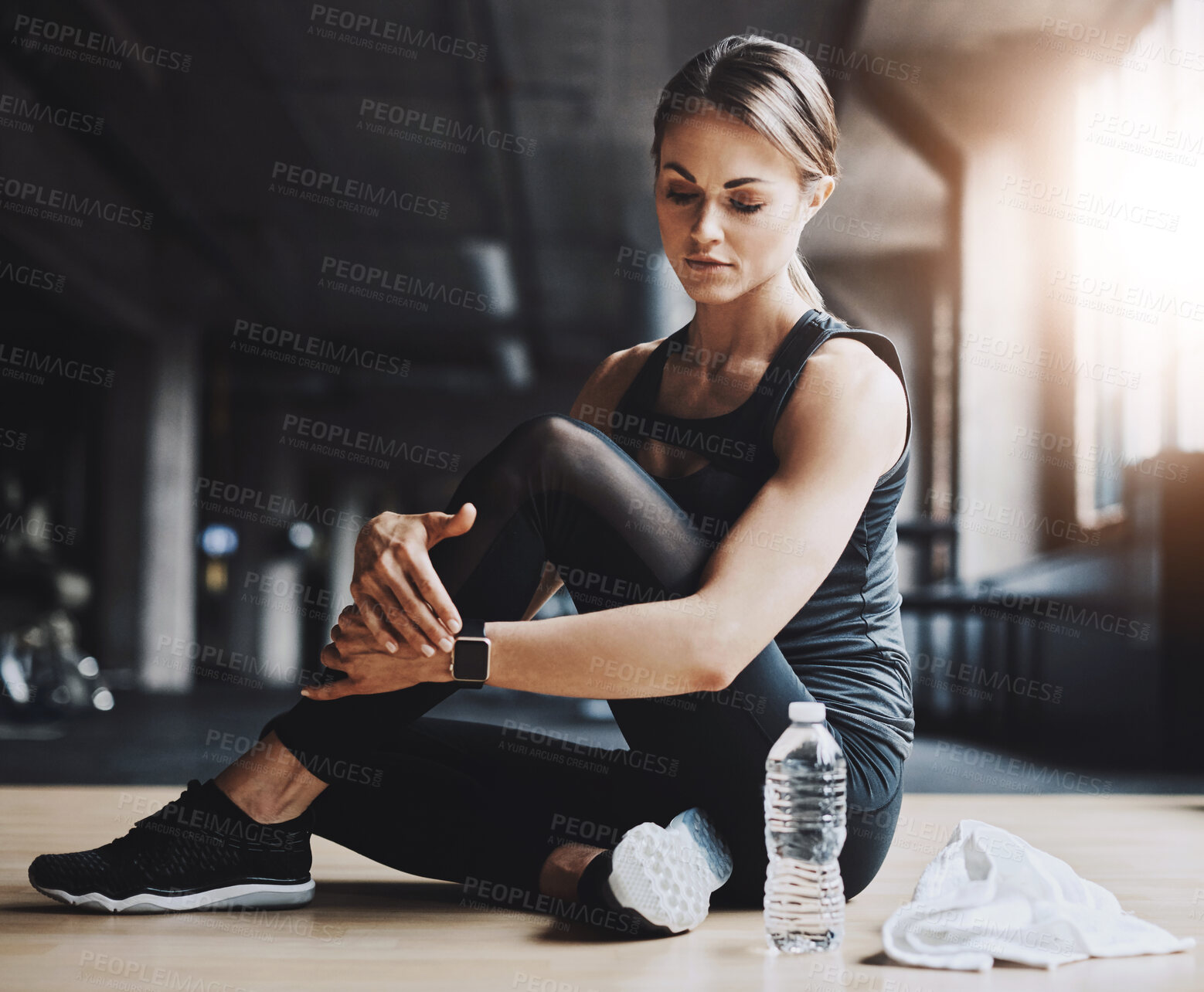 Buy stock photo Rest, fitness and woman in gym with water for training, exercise and cardio workout. Sports, athlete and person on floor for calm, relax and on break for wellness, health and performance with bottle