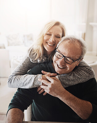 Buy stock photo Senior, couple and laughing with hug in home for healthy marriage, commitment and bonding in retirement. Elderly, people and funny in house for joke, humor and romance with embrace in living room