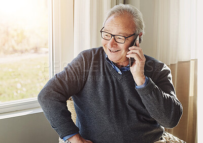 Buy stock photo Senior, man and happy with phone call in home for communication, gossip and mobile chat in retirement. Elderly, person and smartphone for conversation, discussion or smile for connection in house