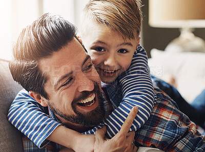 Buy stock photo Father, son and hug on sofa in home, happiness and bonding with parent on weekend break in house. Smile, boy and child development with love, living room and family together for trust with care