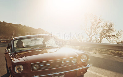 Buy stock photo Car, driving and couple on journey at sunset for travel, vacation or holiday together outdoor in California. Motor vehicle, man and woman on road trip in transport for adventure, relax and freedom