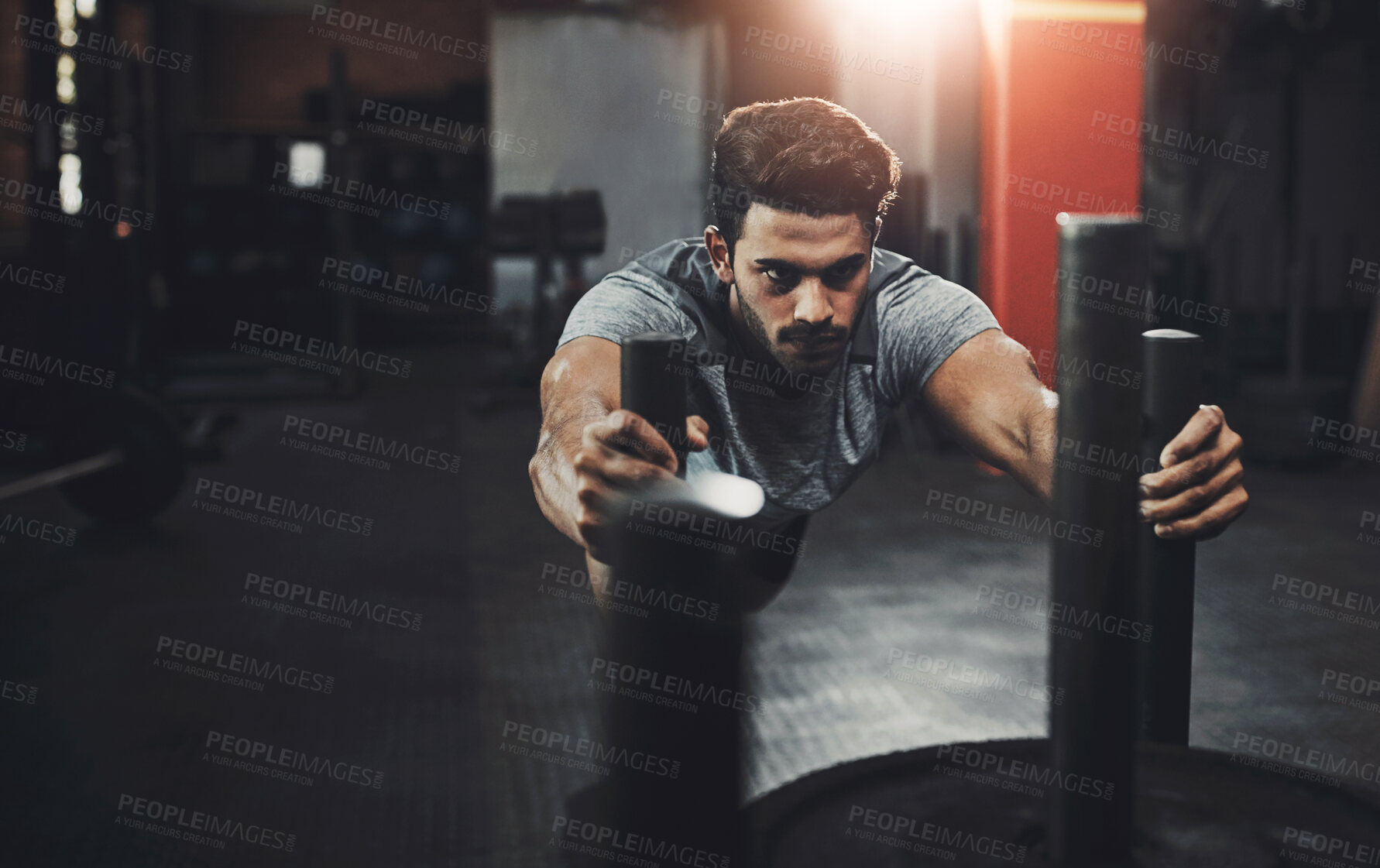 Buy stock photo Man, sled and push in gym for fitness or muscle endurance, leg strength and speed improvement with exercise. Male person, cardio workout and training in recreation center, agility and athlete.