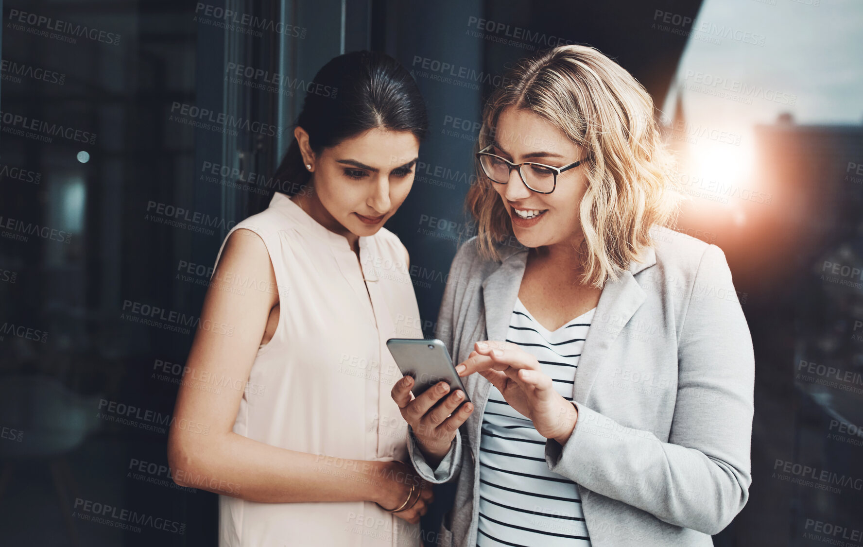 Buy stock photo Office, business and women with phone in discussion for project, help and trading report of client. Balcony, teamwork and women with tech in conversation for investment, plan or stock market research