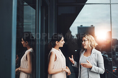 Buy stock photo Office, balcony and business women for teamwork, planning and discussion with conversation. Workplace, project manager and personal assistant for collaboration, communication and ideas by flare