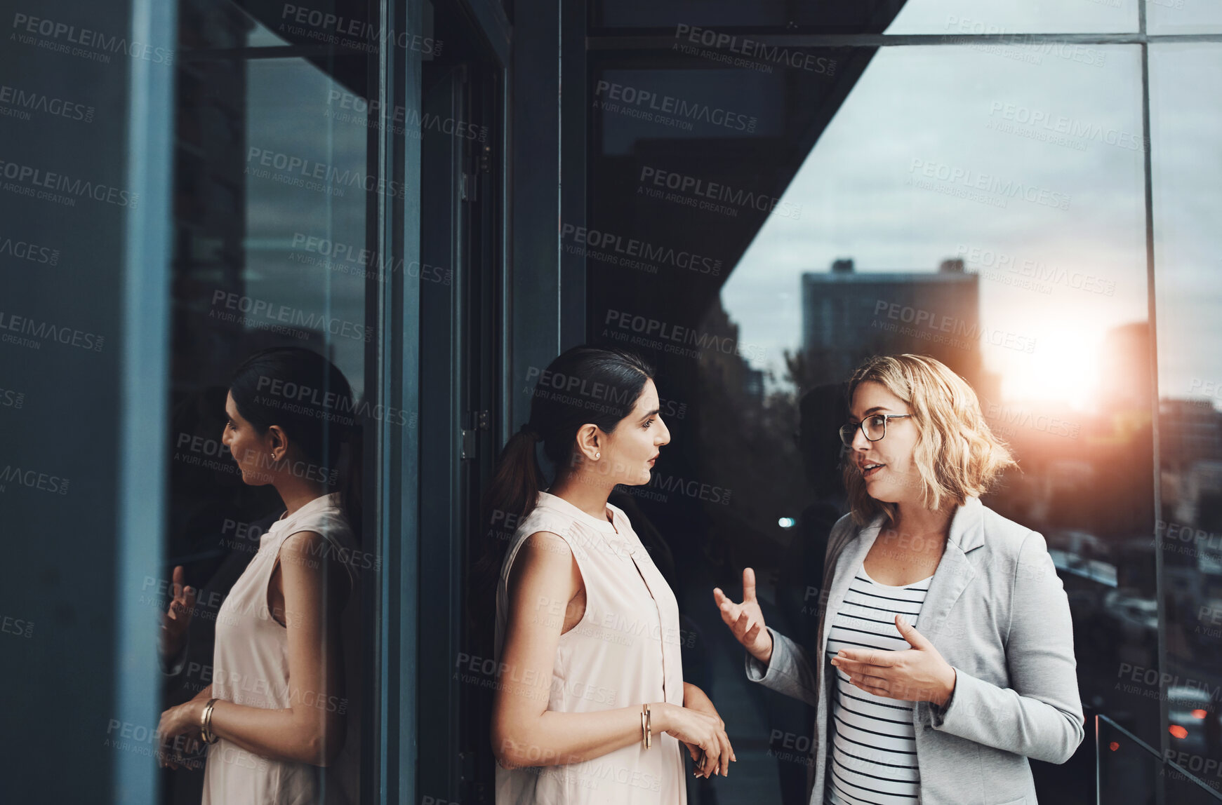 Buy stock photo Office, balcony and business women for teamwork, planning and discussion with conversation. Workplace, project manager and personal assistant for collaboration, communication and ideas by flare