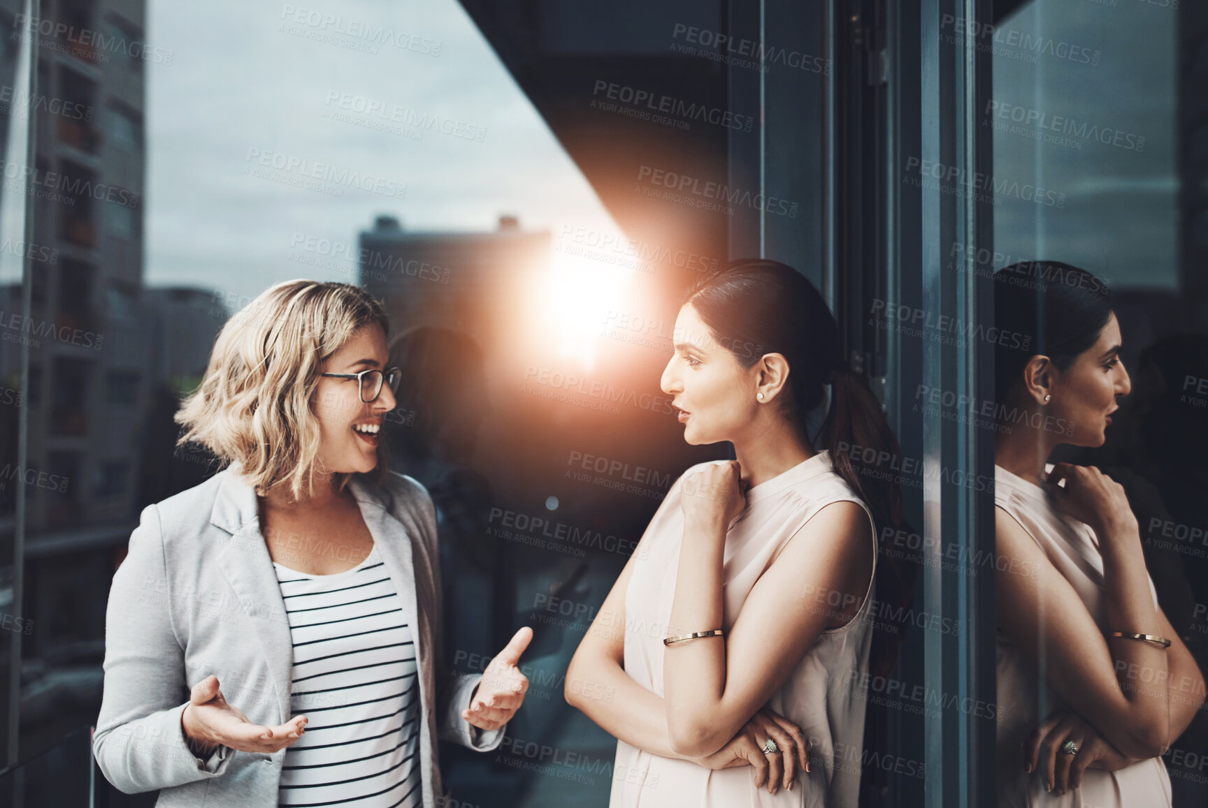 Buy stock photo Office, balcony and business women with discussion, planning and teamwork with conversation. Workplace, project manager and personal assistant for collaboration, communication and ideas by flare