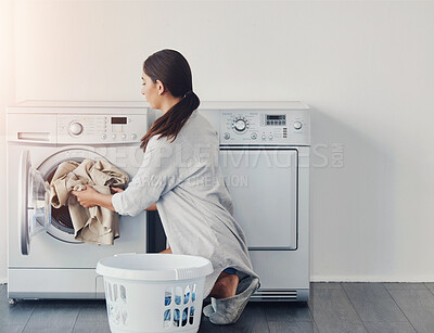 Buy stock photo Housekeeping, woman and washing machine for laundry, cleaning cotton clothes and hygiene with basket. Person, home and girl with chore, service and appliance for detergent routine, linen and fabric