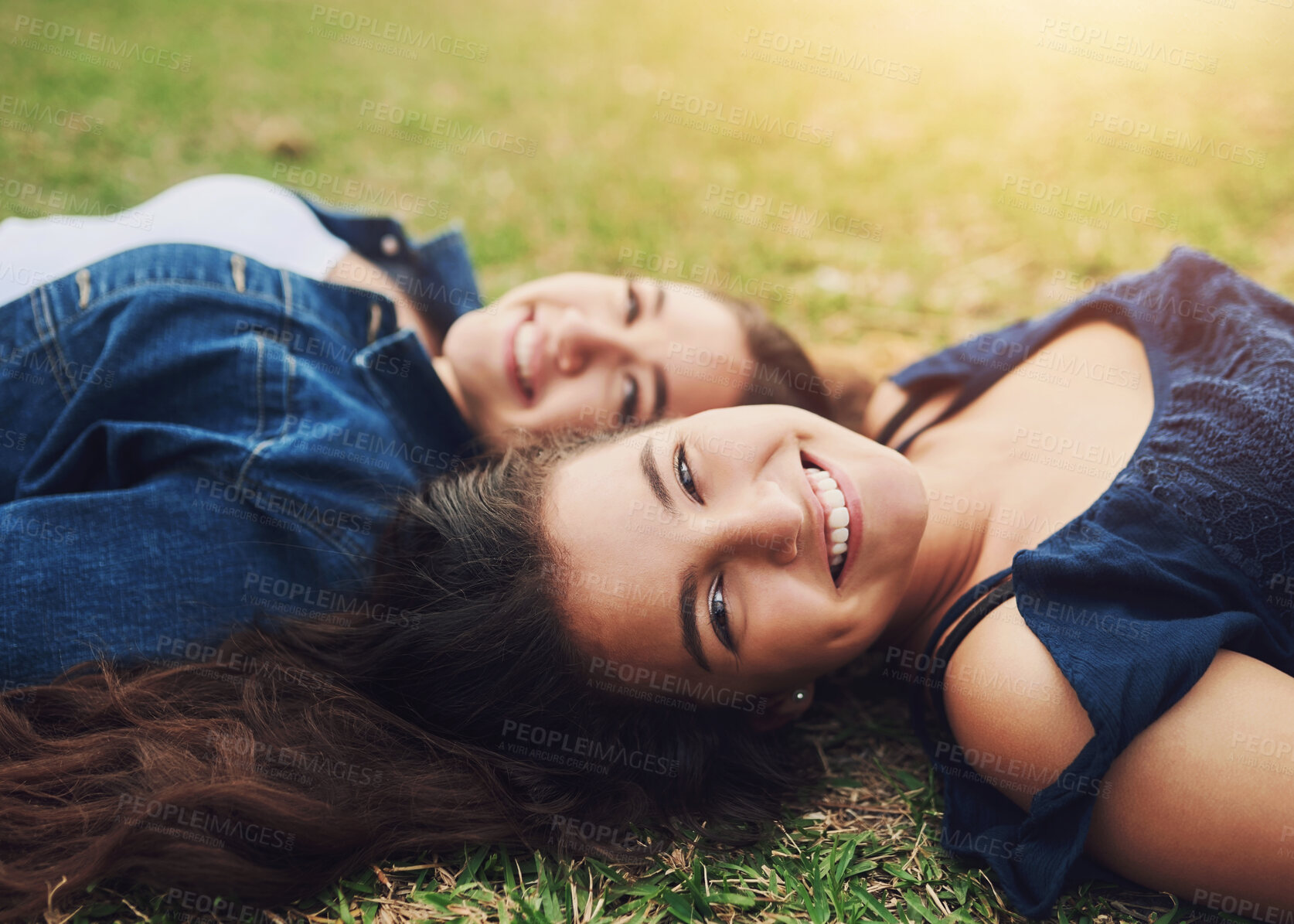 Buy stock photo Teen, friends and park portrait with bonding, love and care together on summer holiday and school break. Garden, lawn and lying on grass with young, happy and women smile outdoor on fun vacation