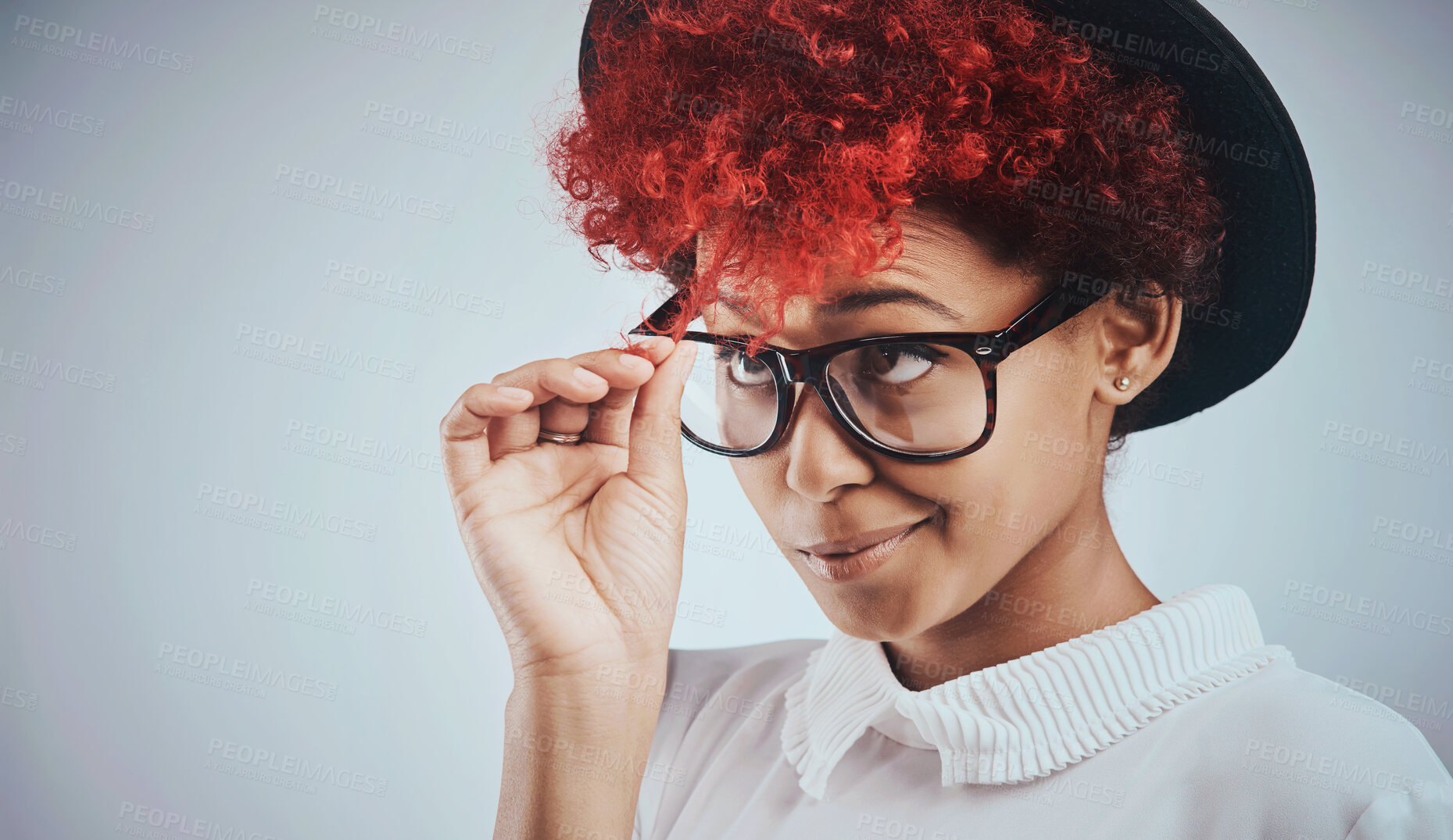 Buy stock photo Woman, hair and pulling curls in studio for growth check, color choice or thinking of new style on white background. Young and funky girl or person with red dye, natural texture and curly maintenance