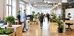 Lobby, busy and business people walk in office, company and startup with staff on computer on desk. Blur, motion and group in coworking space for rush, workflow and moving at workspace with plants