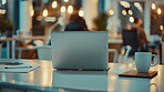 Laptop, coffee and table for office, people and working late in night, bokeh and digital for business. Copywriting, online and coworking on desk, writer and colleagues in company and creative