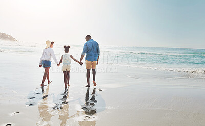 Buy stock photo Happy family, back and walking with holding hands on beach for bonding, holiday or outdoor weekend. Mother, father and child enjoying stroll on sand in sunshine together by ocean coast in nature