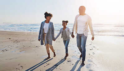 Buy stock photo Black family, happy and holding hands for walking on beach with travel memory, vacation or summer holiday. Parents, kid or bonding in nature with fun activity, scenery and smile for sunset adventure
