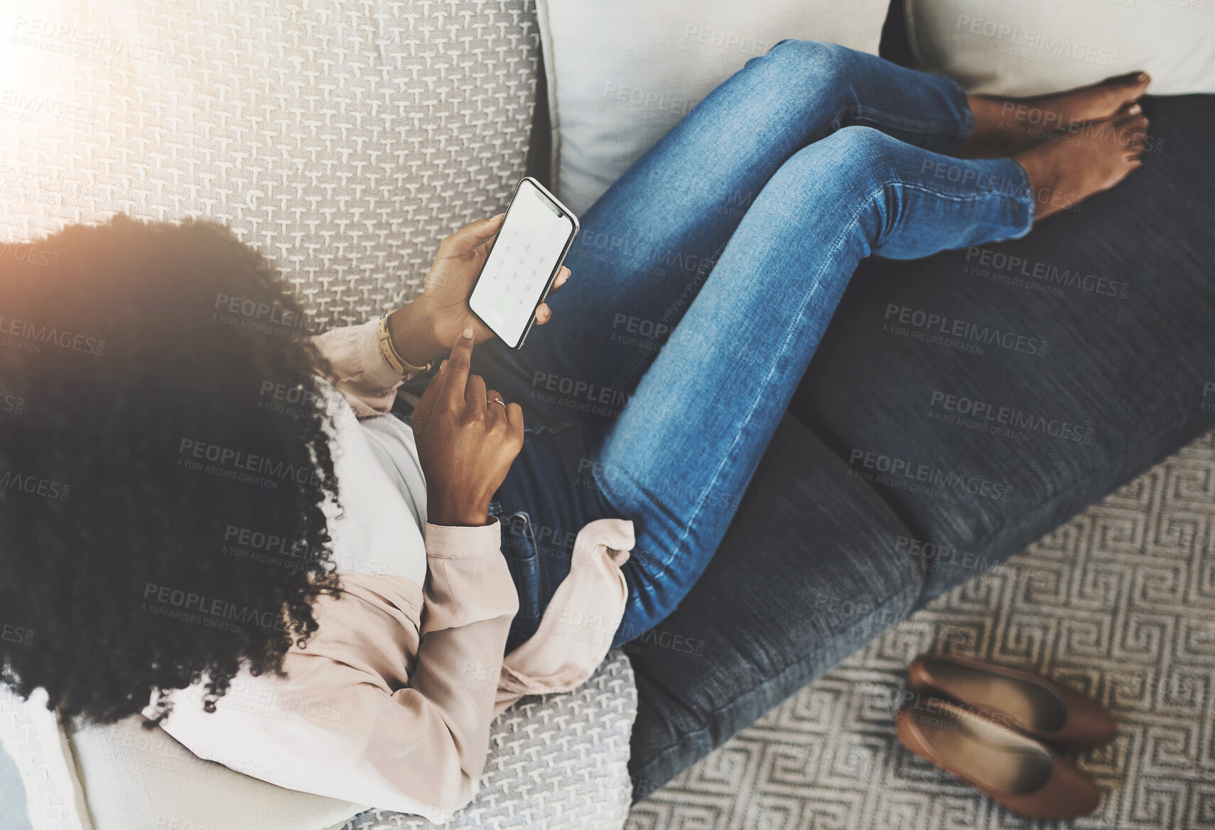 Buy stock photo Black woman, couch or relax with phone screen or mockup with biometric encryption, password or code for safety. Female person, sofa or mobile with security for tech in home above, typing for access