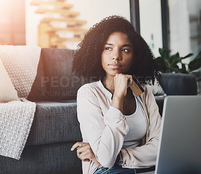 Buy stock photo Thinking, laptop and woman with credit card on floor for subscription, payment or online shopping in living room. Decision, thoughtful and person for ideas, streaming service or investment in home