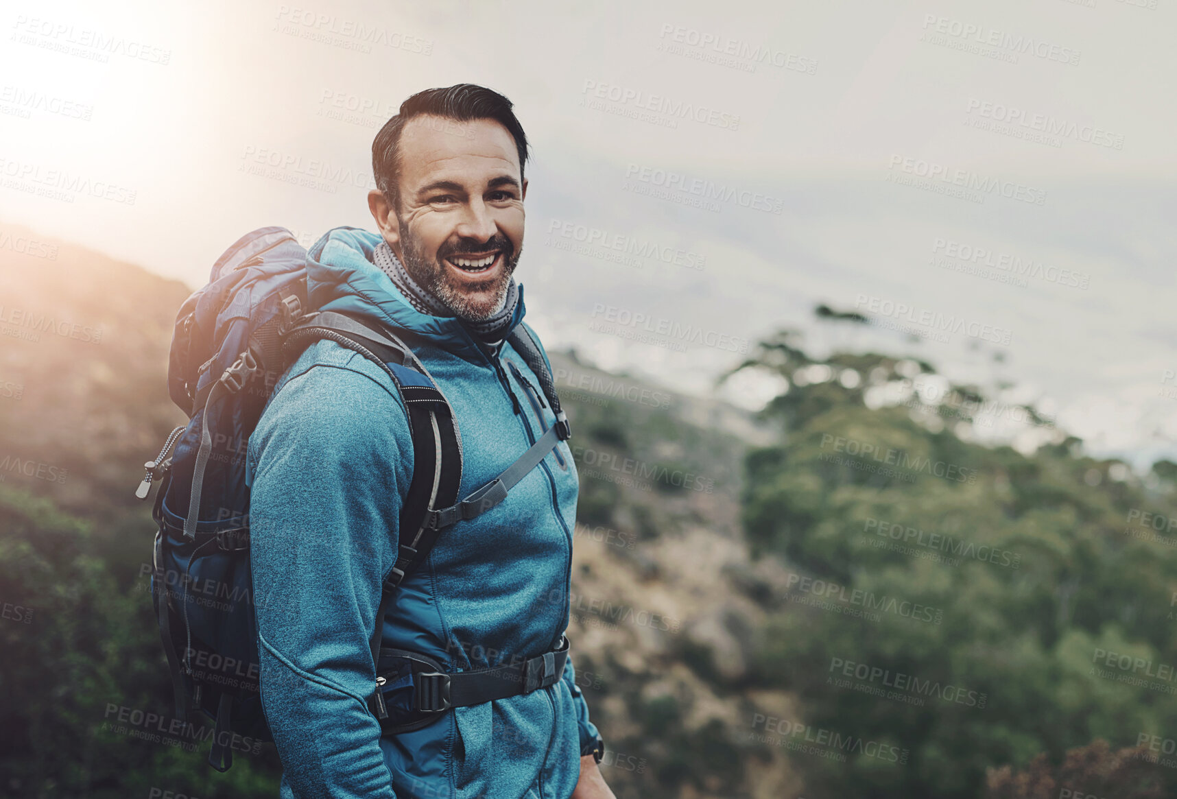 Buy stock photo Mature, man and hiking portrait in nature, wellness and mountain trial for fitness or cardio exercise. Happiness, confident and smile for back pack journey, outdoors and trekking on weekend break