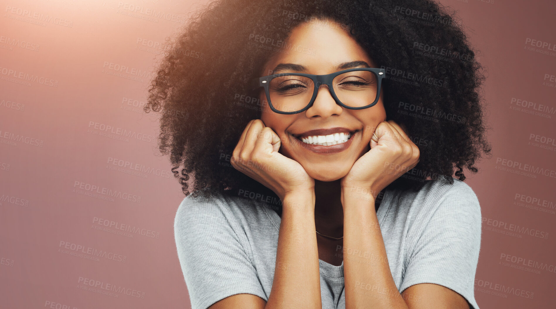 Buy stock photo Happy, black woman and portrait with glasses in joy for positive or smart in studio on a background. Young African, female person or nerd with smile or afro for creativity, relax or crazy style