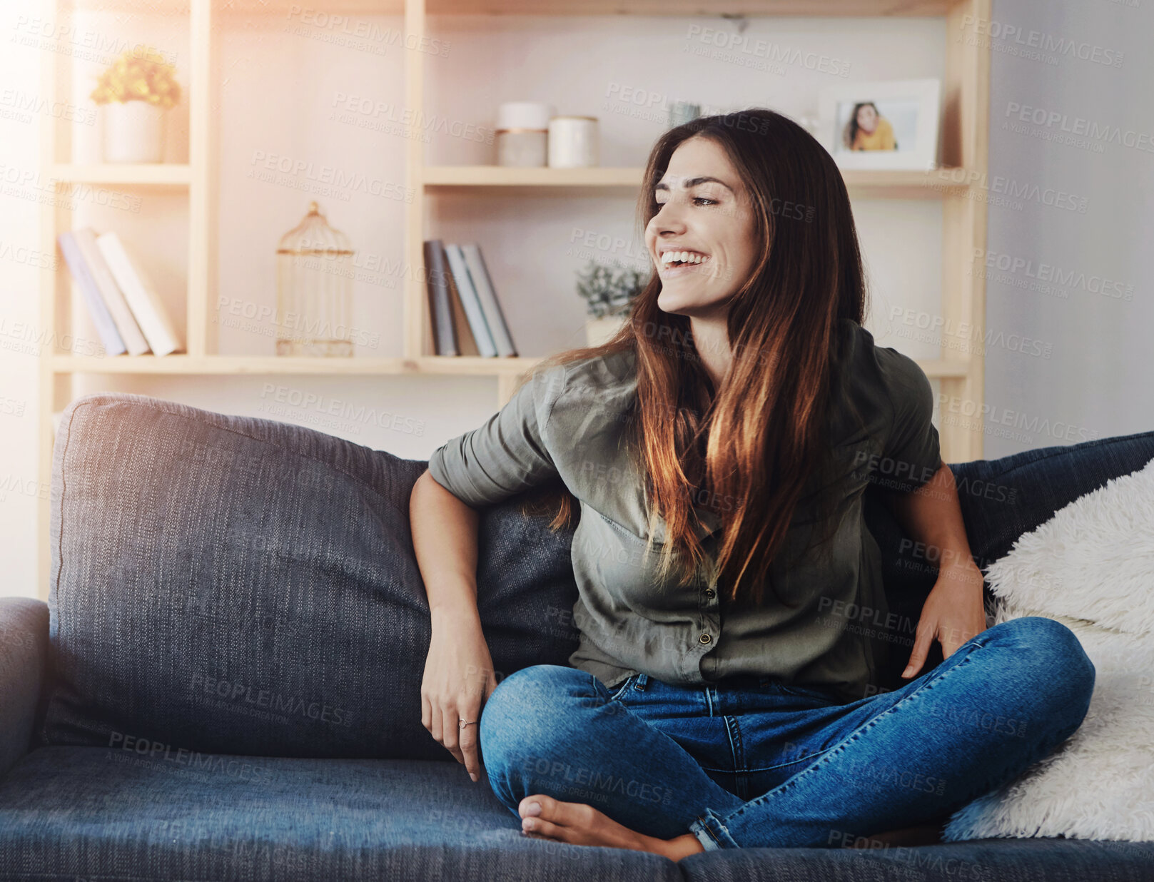 Buy stock photo Relax, smile and thinking with woman on sofa in living room of home for break, rest or wellness. Comfortable, idea and legs crossed with happy person on couch in apartment for weekend time off