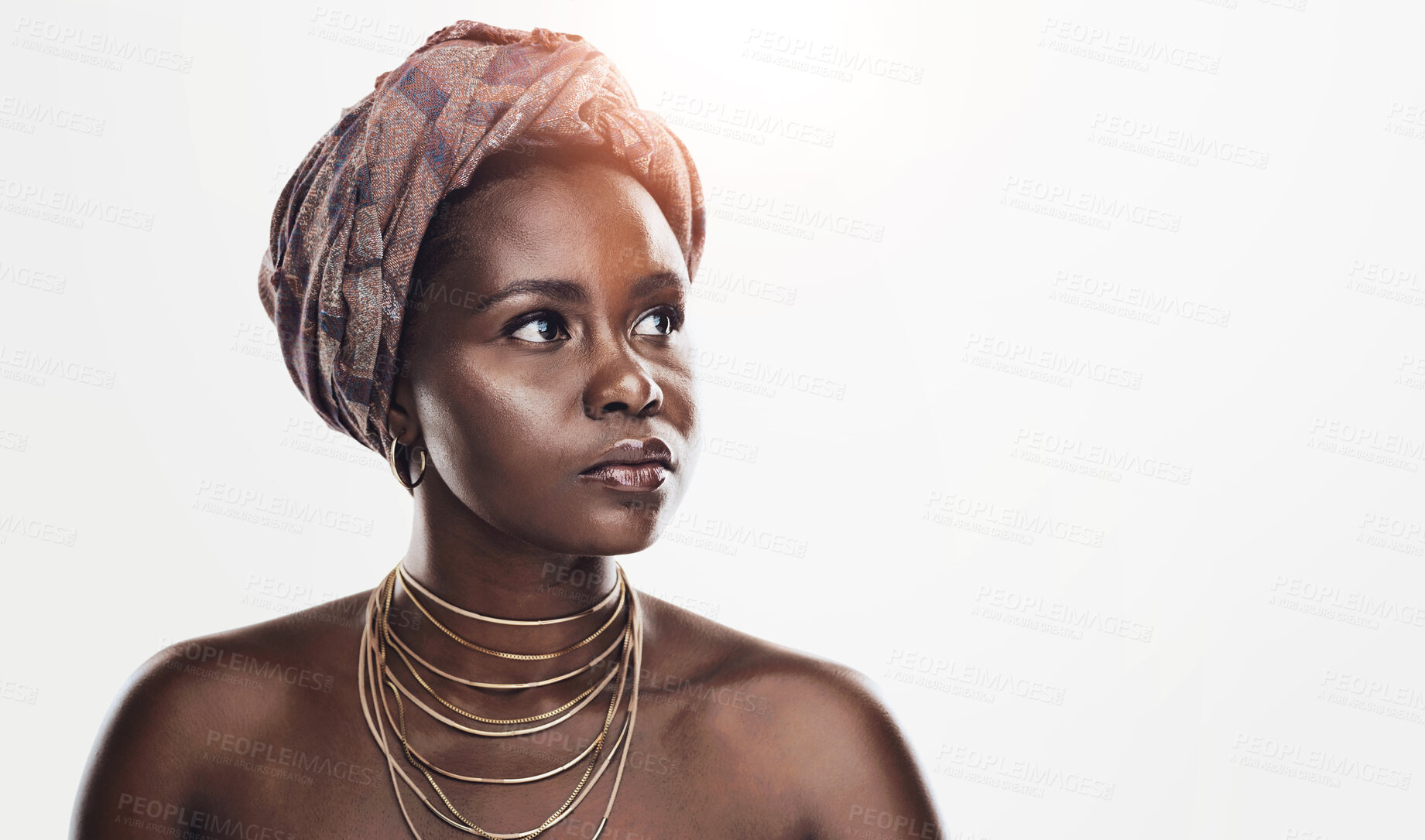 Buy stock photo Beauty, culture and black woman in studio with wrap, inspiration and natural glow on mockup. Pride, confidence and African girl with traditional makeup, unique identity and scarf on white background