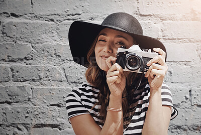 Buy stock photo Woman, photographer and retro camera by brick wall in portrait for job in media, press or newspaper in city. Person, journalist and shooting in street for investigation, story or happy in Los Angeles