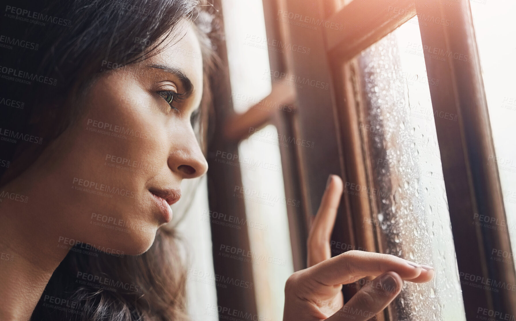 Buy stock photo Thinking, sad and woman in window by rain, winter weather and water with drops for gloomy atmosphere. Home, lonely and female person with seasonal affective disorder, low energy and climate change