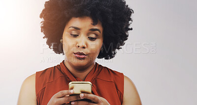 Buy stock photo Phone, scam and thinking with black woman in studio on white background for communication or social media. Doubt, gossip and text message on mobile with afro person typing email for networking