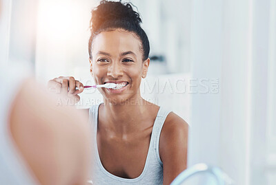 Buy stock photo Dental hygiene, bathroom and woman brushing teeth for health, wellness and morning routine. Oral care, teeth whitening and female person with clean mouth treatment for fresh breath by mirror at home.