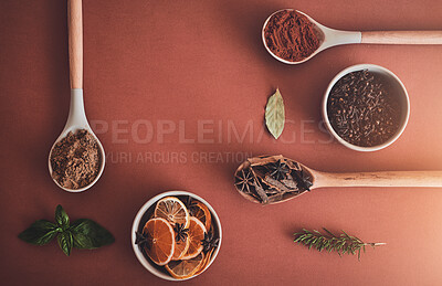 Buy stock photo Healthy, spices and ingredients for meal, food and wooden spoons on studio background. Empty, kitchen utensils and mockup space with seasoning, variety and organic with fine dining, recipe and herbs