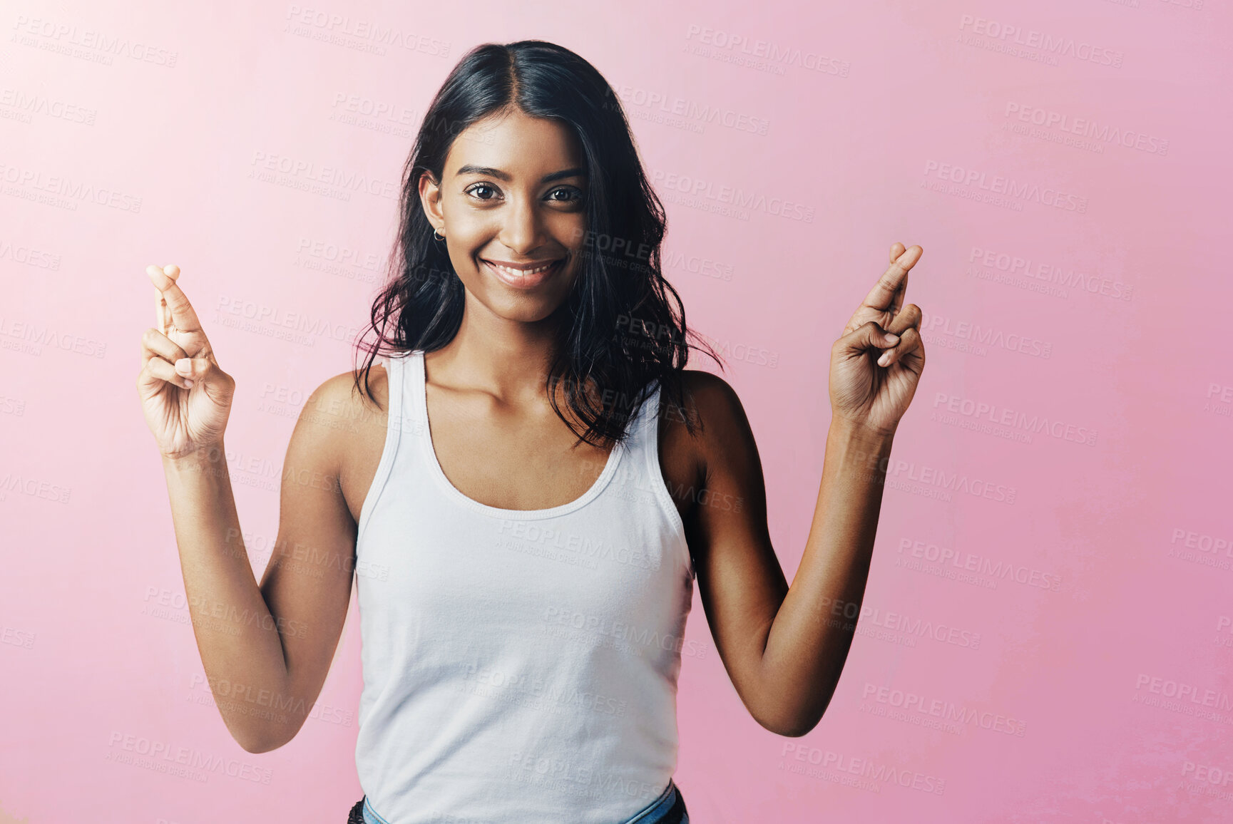 Buy stock photo Studio, portrait and indian woman with fingers crossed for hope, trust and good luck for positive outcome for wish. Female person, hands and gesture of signal for sincerity, hope and pink background