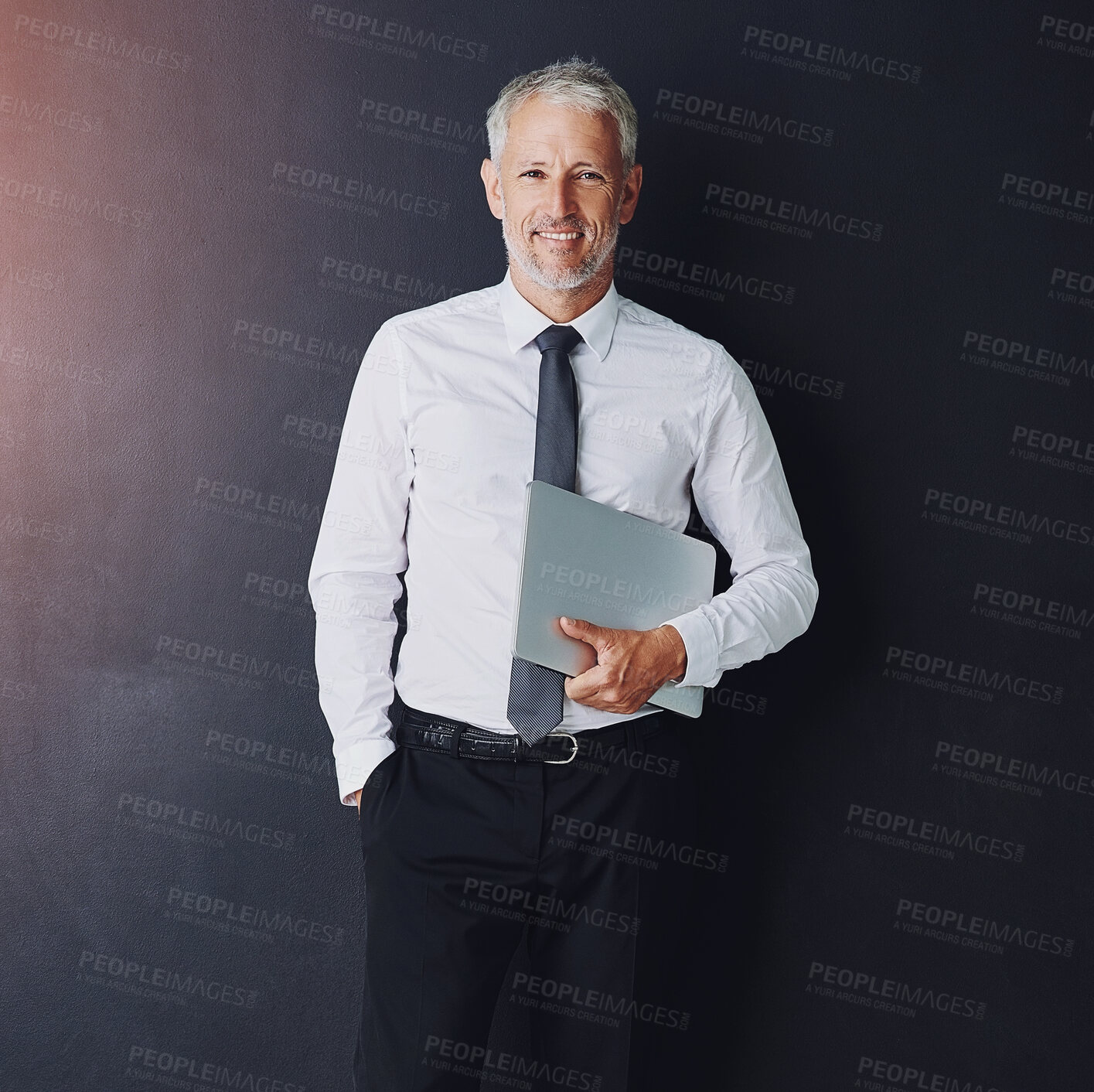 Buy stock photo Mature businessman, laptop and smile in studio portrait with pride for corporate career by black background. Person, executive or actuary with computer, happy and job at insurance agency in Australia