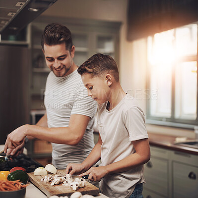 Buy stock photo Cooking, dad and son in kitchen, teaching and ingredients with time together, hobby and child development. Parent, father or boy with nutrition, learning and help with support, care or family in home