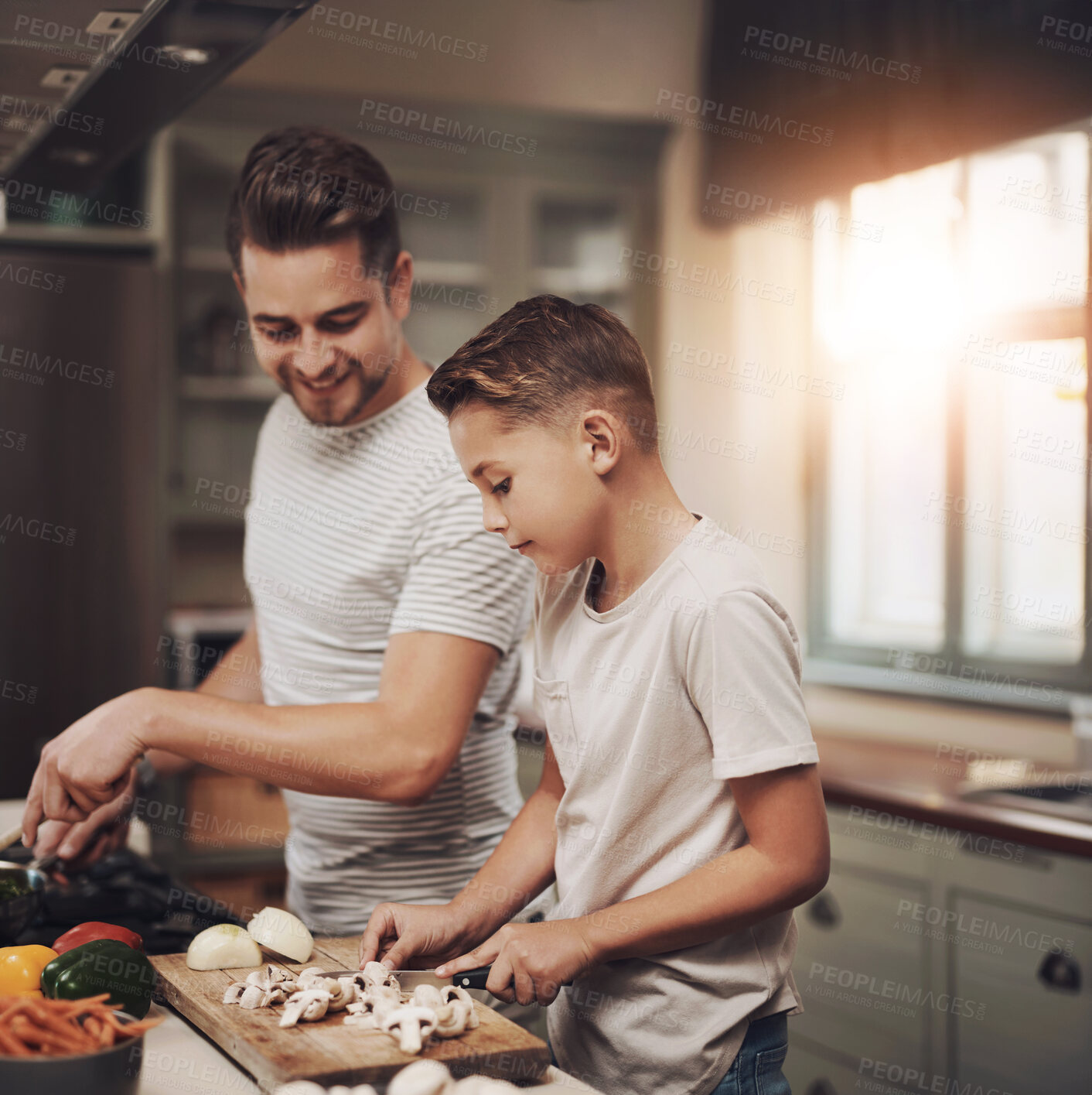 Buy stock photo Cooking, dad and son in kitchen, teaching and ingredients with time together, hobby and child development. Parent, father or boy with nutrition, learning and help with support, care or family in home