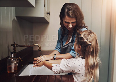 Buy stock photo Mother, kid and washing hands in family home with hygiene learning and wellness in kitchen. Health, water and helping with safety from bacteria and dirt with cleaning and teaching with love and care