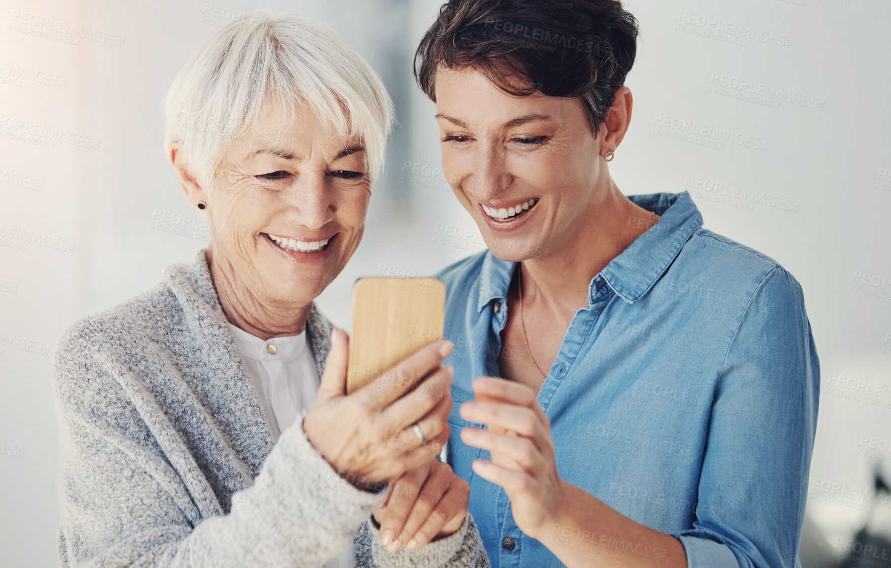 Buy stock photo Smile, phone and woman with senior mom for picture memory, social media post and bonding together in home. Elderly mother, daughter and mobile for web blog, online photo gallery and helping with app